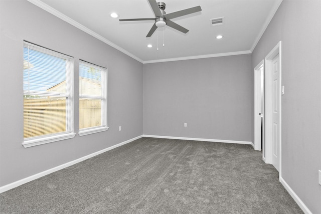 spare room with dark carpet, ornamental molding, ceiling fan, recessed lighting, and baseboards
