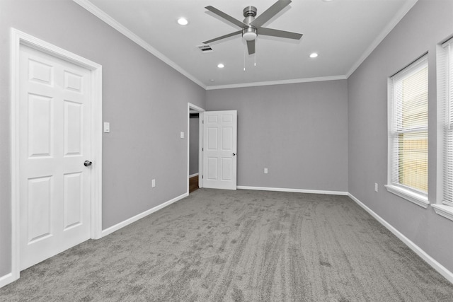 unfurnished bedroom with ornamental molding, carpet flooring, recessed lighting, baseboards, and ceiling fan
