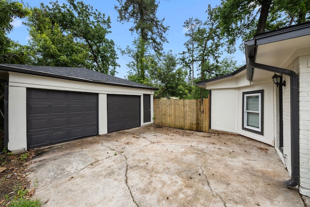 garage featuring fence