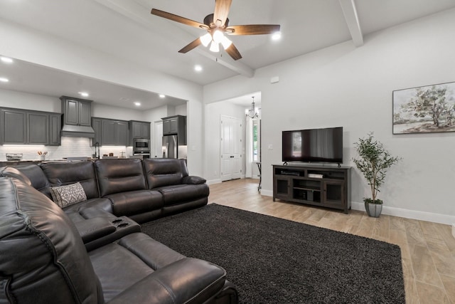 100 Calvary Dr, Adkins, TX 78101 - living room with beamed ceiling, a chandelier, light wood finished floors, a ceiling fan, and recessed lighting