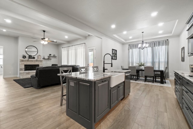 100 Calvary Dr, Adkins, TX 78101 - kitchen with a sink, dishwasher, light wood-style flooring, healthy amount of natural light, and recessed lighting