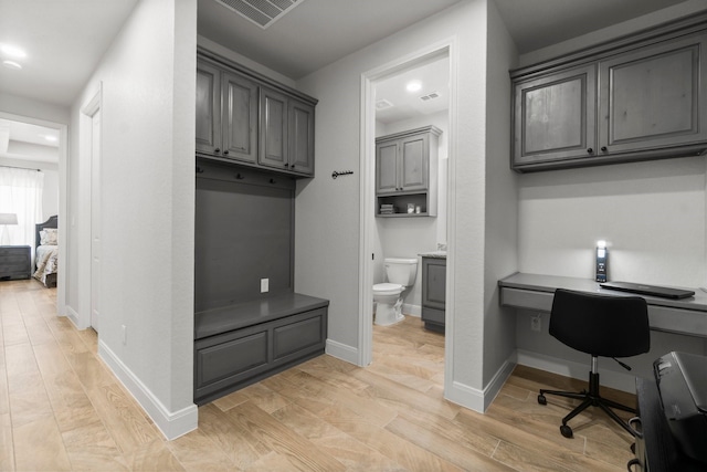 100 Calvary Dr, Adkins, TX 78101 - home office featuring built in study area, light wood-style flooring, and baseboards