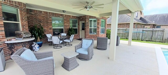 view of patio / terrace featuring fence, a ceiling fan, outdoor dining space, and grilling area