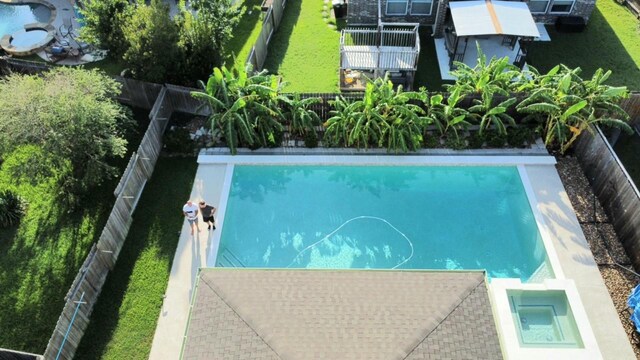 view of swimming pool with fence