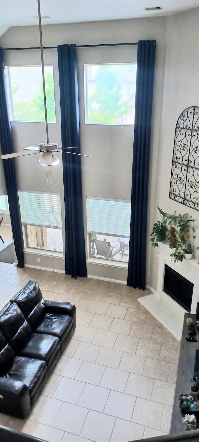 living room featuring healthy amount of natural light and tile patterned flooring