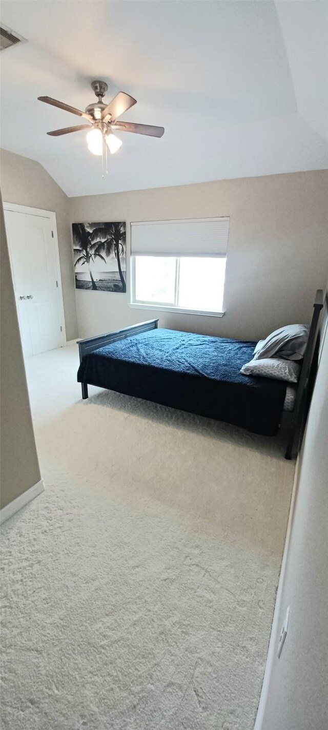 carpeted bedroom with a ceiling fan