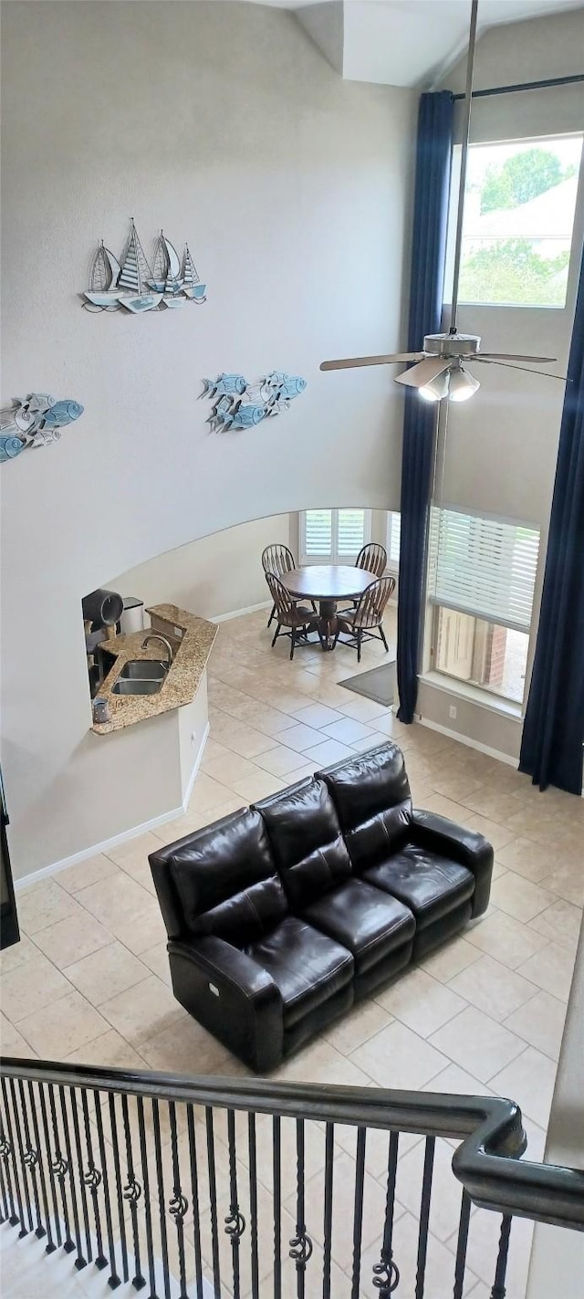 17315 Cumberland Park Ln, Humble, TX 77346 - living area with light tile patterned flooring, plenty of natural light, and baseboards