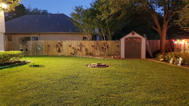 15223 Hillside Park Way, Cypress, TX 77433 - view of yard featuring an outdoor fire pit, a storage unit, and an outdoor structure