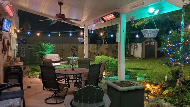 15223 Hillside Park Way, Cypress, TX 77433 - patio at twilight featuring a ceiling fan and outdoor dining area