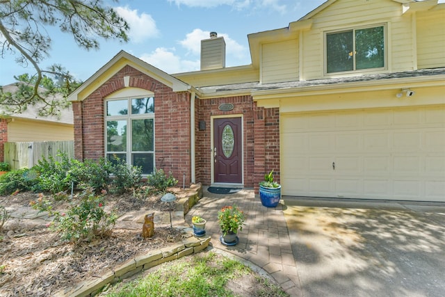 15223 Hillside Park Way, Cypress, TX 77433 - view of front facade featuring brick siding, a chimney, fence, and a garage