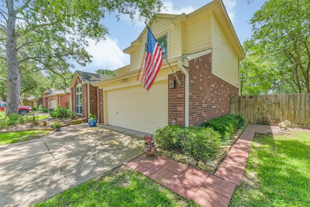 15223 Hillside Park Way, Cypress, TX 77433 - view of front of home with brick siding, a garage, driveway, and fence