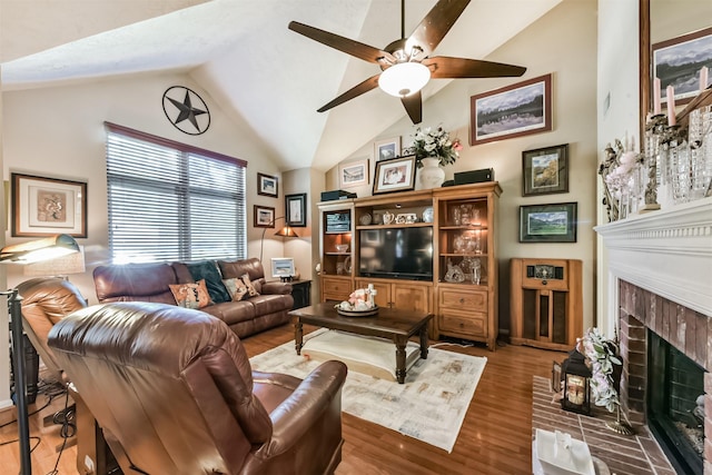 15223 Hillside Park Way, Cypress, TX 77433 - living room featuring vaulted ceiling, ceiling fan, a fireplace, and wood finished floors