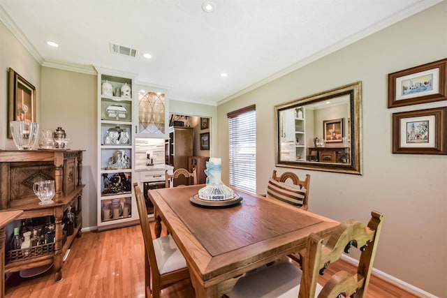 15223 Hillside Park Way, Cypress, TX 77433 - dining room with light wood-style flooring, ornamental molding, recessed lighting, and baseboards