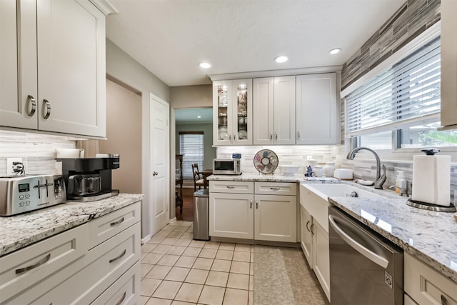 15223 Hillside Park Way, Cypress, TX 77433 - kitchen featuring appliances with stainless steel finishes, a sink, backsplash, recessed lighting, and glass insert cabinets