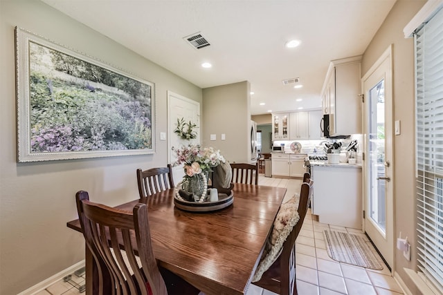 15223 Hillside Park Way, Cypress, TX 77433 - dining area with light tile patterned floors, plenty of natural light, baseboards, and recessed lighting