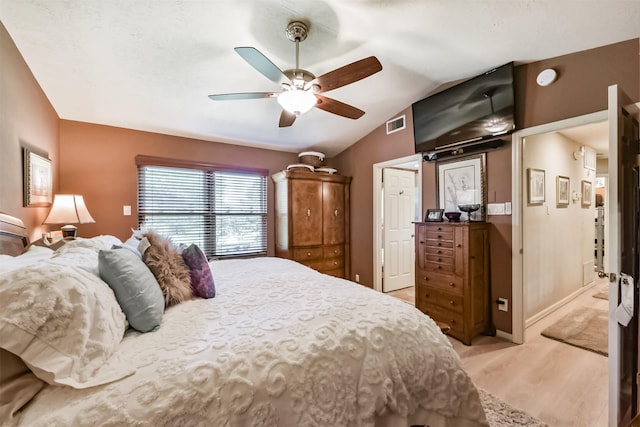 15223 Hillside Park Way, Cypress, TX 77433 - bedroom featuring vaulted ceiling, light wood-style floors, ceiling fan, and baseboards