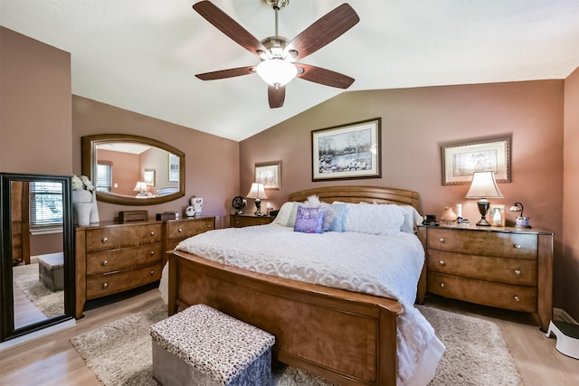 15223 Hillside Park Way, Cypress, TX 77433 - bedroom featuring light wood finished floors, lofted ceiling, and ceiling fan