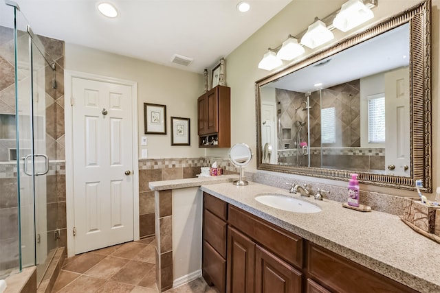 15223 Hillside Park Way, Cypress, TX 77433 - bathroom with a stall shower, vanity, tile patterned floors, recessed lighting, and tile walls