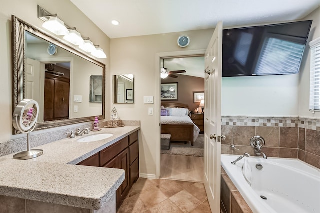15223 Hillside Park Way, Cypress, TX 77433 - full bathroom featuring connected bathroom, a bath, ceiling fan, tile patterned flooring, and vanity
