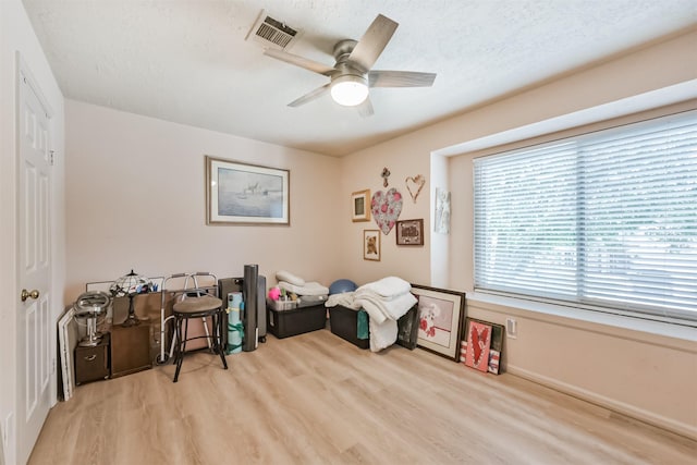 15223 Hillside Park Way, Cypress, TX 77433 - game room with wood finished floors, ceiling fan, and a textured ceiling