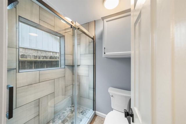 16330 Autumn Wind Dr, Houston, TX 77090 - full bathroom featuring toilet, a stall shower, and baseboards