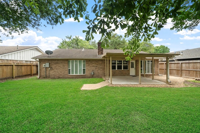 16330 Autumn Wind Dr, Houston, TX 77090 - rear view of property with a chimney, a patio, and brick siding