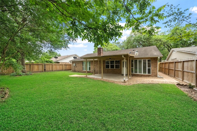 16330 Autumn Wind Dr, Houston, TX 77090 - rear view of property featuring a chimney, a patio area, brick siding, and ceiling fan