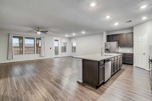 15335 Oakheath Colony Ln, Houston, TX 77044 - kitchen with a sink, appliances with stainless steel finishes, plenty of natural light, recessed lighting, and a ceiling fan