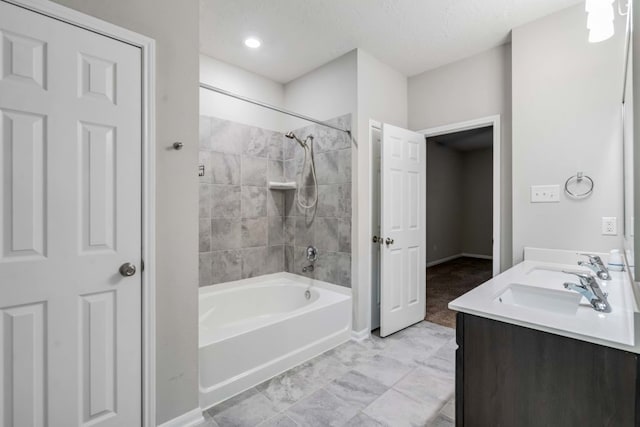15335 Oakheath Colony Ln, Houston, TX 77044 - full bath featuring shower / bath combination, baseboards, and double vanity