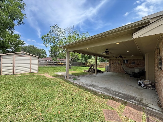 13642 Greenridge Dr, Sugar Land, TX 77498 - view of yard featuring a ceiling fan, a patio, a shed, and an outdoor structure