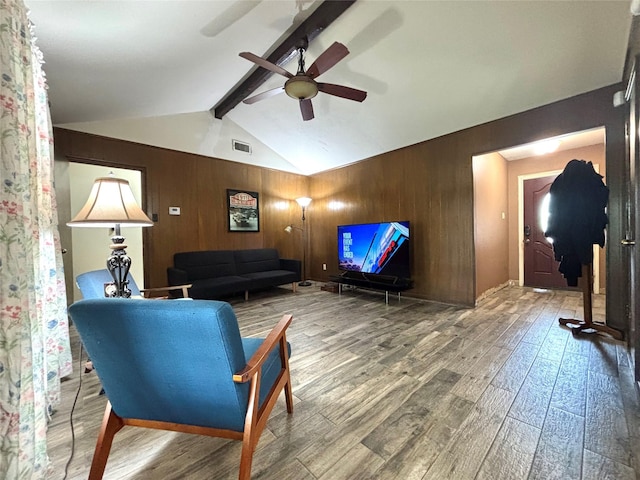 13642 Greenridge Dr, Sugar Land, TX 77498 - living room featuring a ceiling fan, hardwood / wood-style flooring, and wood walls