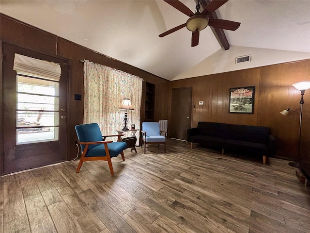 13642 Greenridge Dr, Sugar Land, TX 77498 - sitting room with wood walls, ceiling fan, and wood finished floors