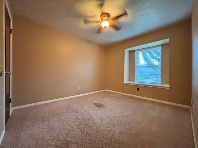13642 Greenridge Dr, Sugar Land, TX 77498 - carpeted spare room featuring a ceiling fan and baseboards