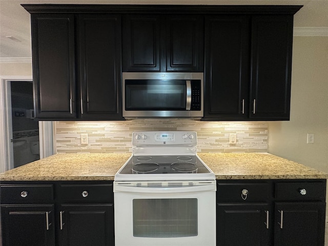 11905 Algonquin Dr Unit 10, Houston, TX 77089 - kitchen featuring stainless steel microwave, white electric range, dark cabinets, crown molding, and backsplash
