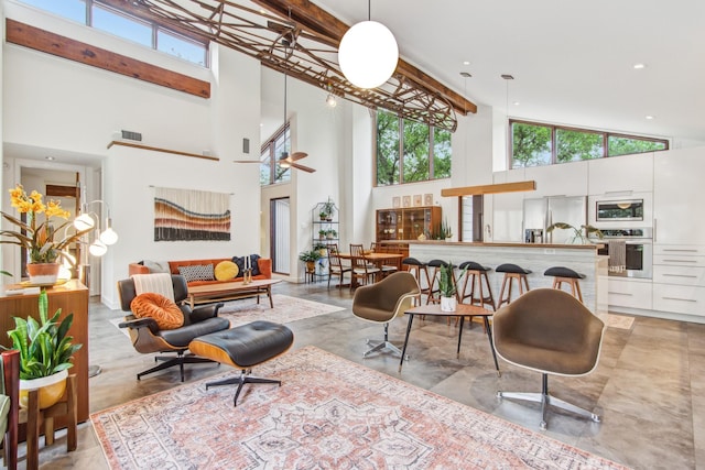 common area with high vaulted ceiling