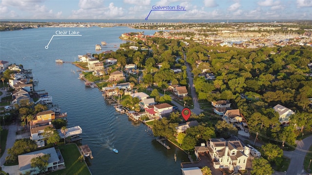 aerial overview of property's location featuring a nearby body of water and nearby suburban area