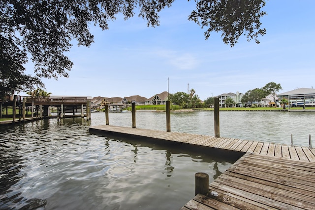 dock with a water view and a residential view