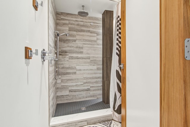 bathroom with a shower stall