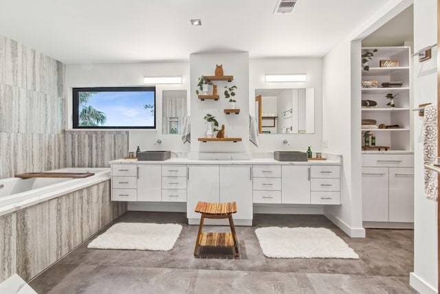full bath featuring healthy amount of natural light, vanity, and a garden tub