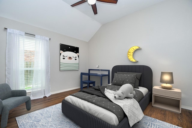 bedroom with baseboards, wood finished floors, lofted ceiling, and a ceiling fan