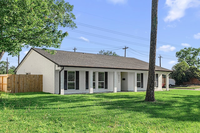 single story home featuring brick siding and a shingled roof