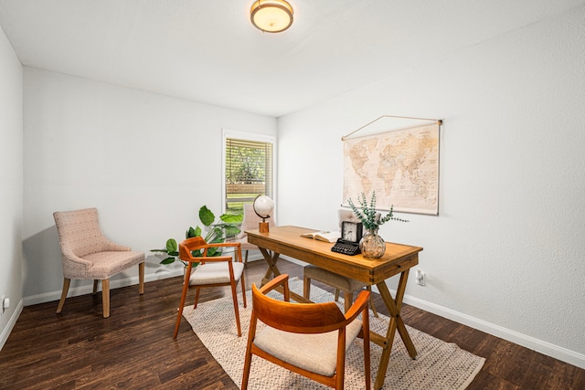 office space with baseboards and dark wood-style floors