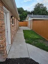 fenced backyard with a patio area