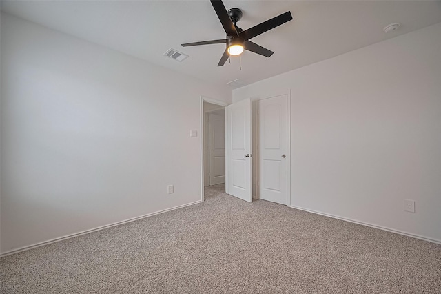 5422 Evergreen Heights Ln, Spring, TX 77373 - unfurnished bedroom with light carpet, ceiling fan, and baseboards