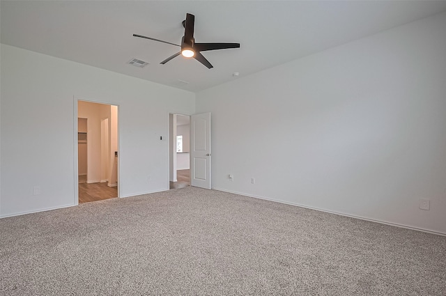 5422 Evergreen Heights Ln, Spring, TX 77373 - unfurnished bedroom with light colored carpet, baseboards, and ceiling fan
