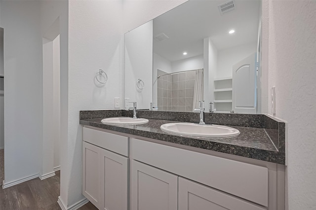 5422 Evergreen Heights Ln, Spring, TX 77373 - full bathroom featuring wood finished floors, a shower with shower curtain, and double vanity