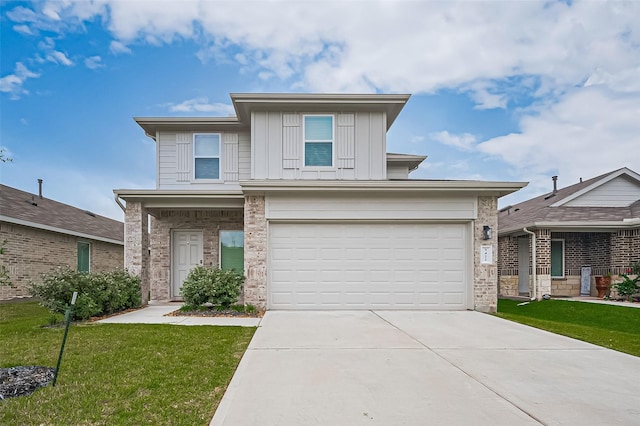 5422 Evergreen Heights Ln, Spring, TX 77373 - view of front of property featuring concrete driveway, a garage, a front yard, brick siding, and board and batten siding