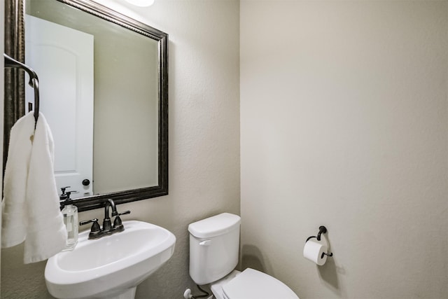 bathroom with a sink and toilet