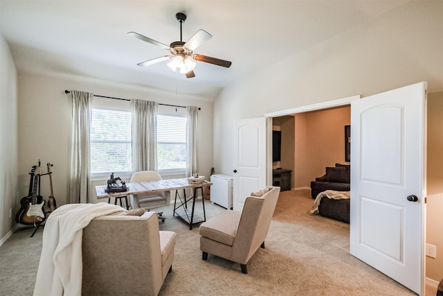 office area featuring light carpet, ceiling fan, and lofted ceiling