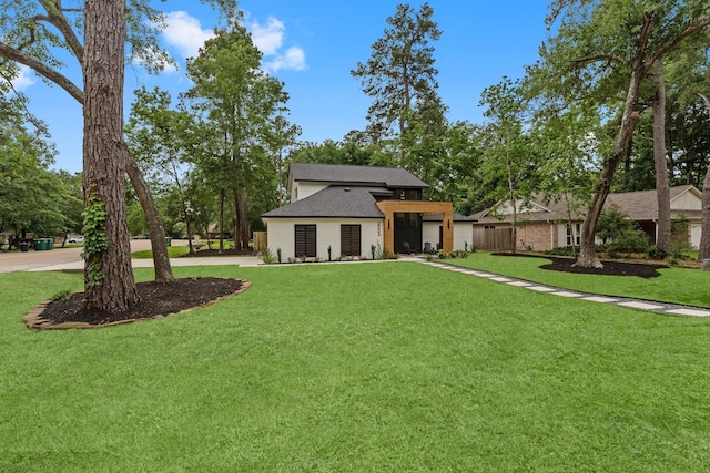 2003 Longstraw Pl, The Woodlands, TX 77380 - view of front of house featuring roof with shingles
